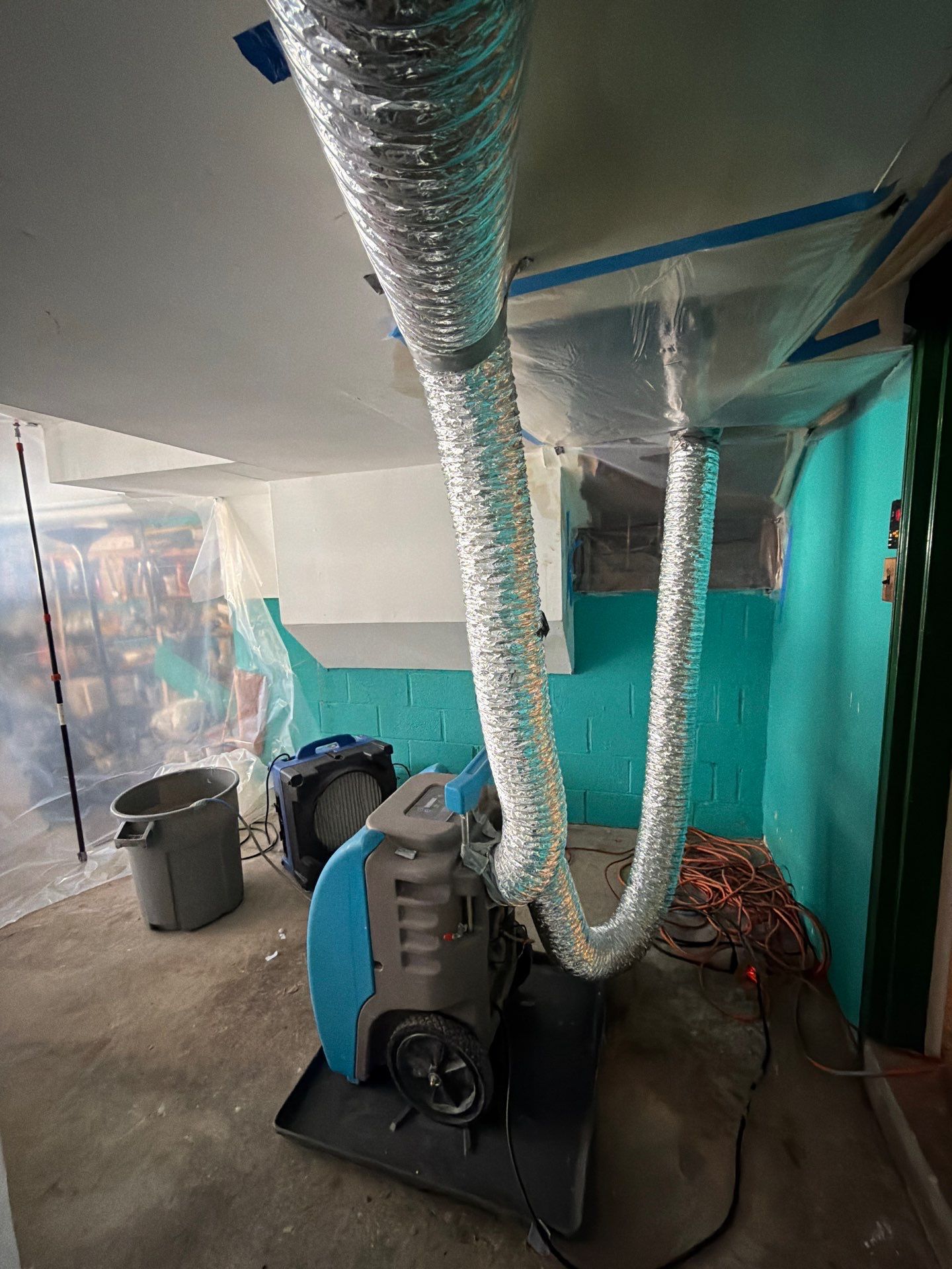 Containment and drying in progress during water damage restoration work.