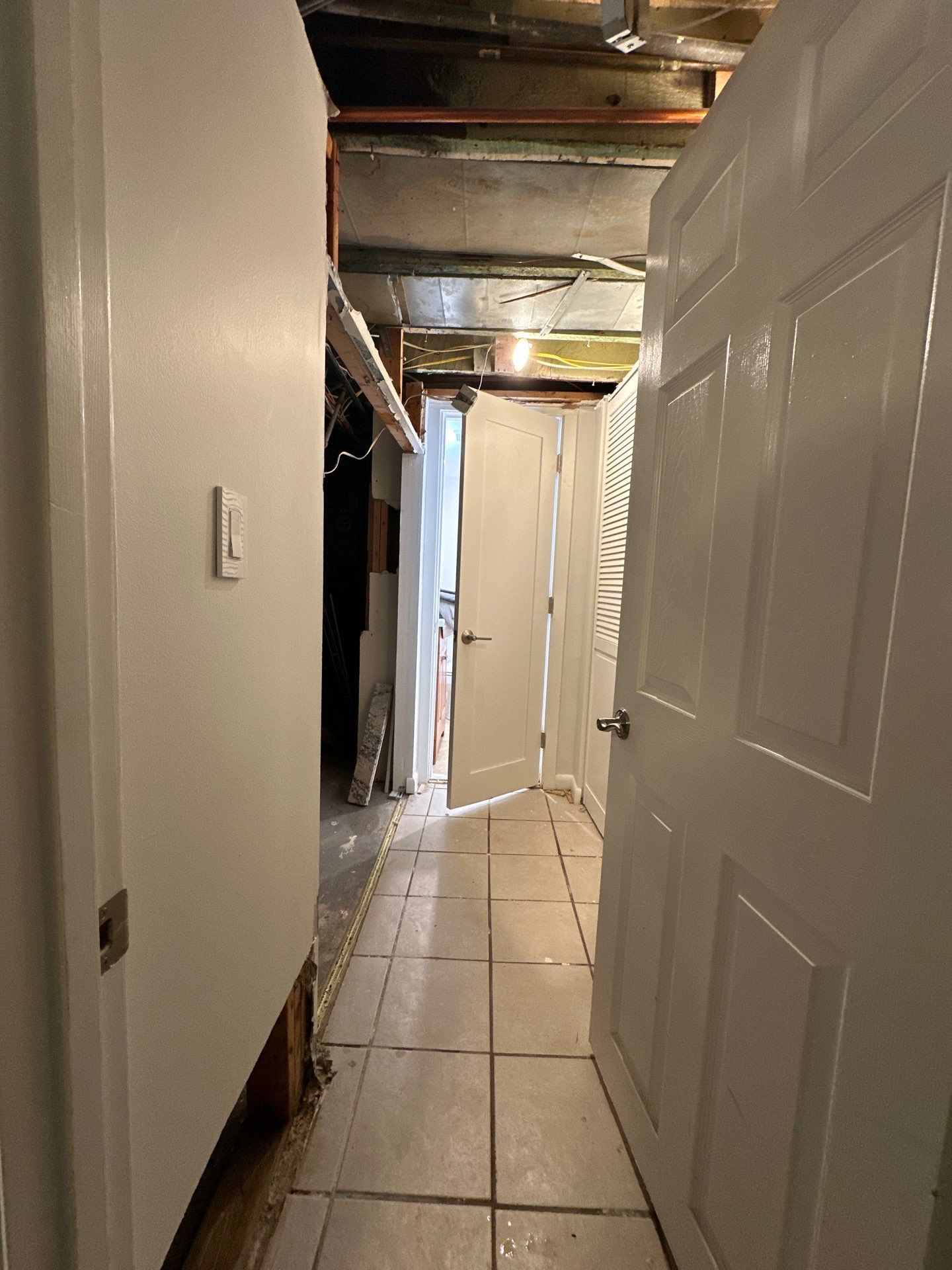 Structural drying in progress, targeting moisture trapped within walls and subflooring during remediation.