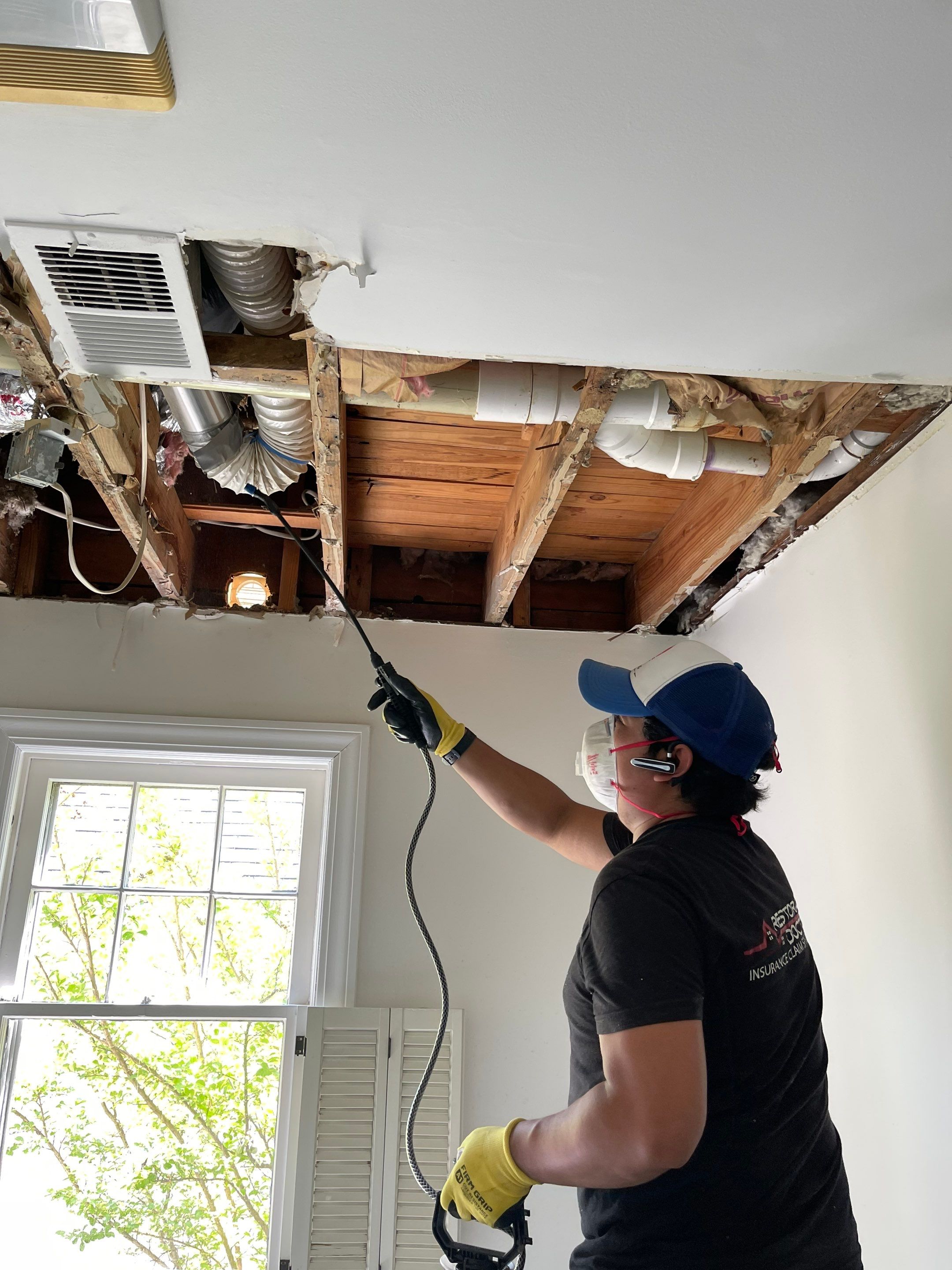 Structural drying in progress, with air movers and dehumidifiers working to extract residual moisture from building materials.
