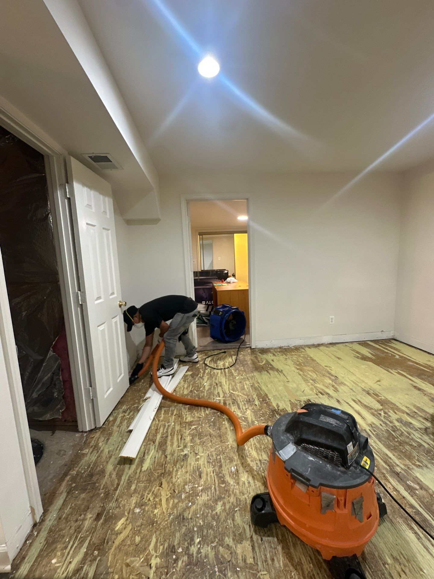 Standing water removal begins mold remediation in Gaithersburg basement.