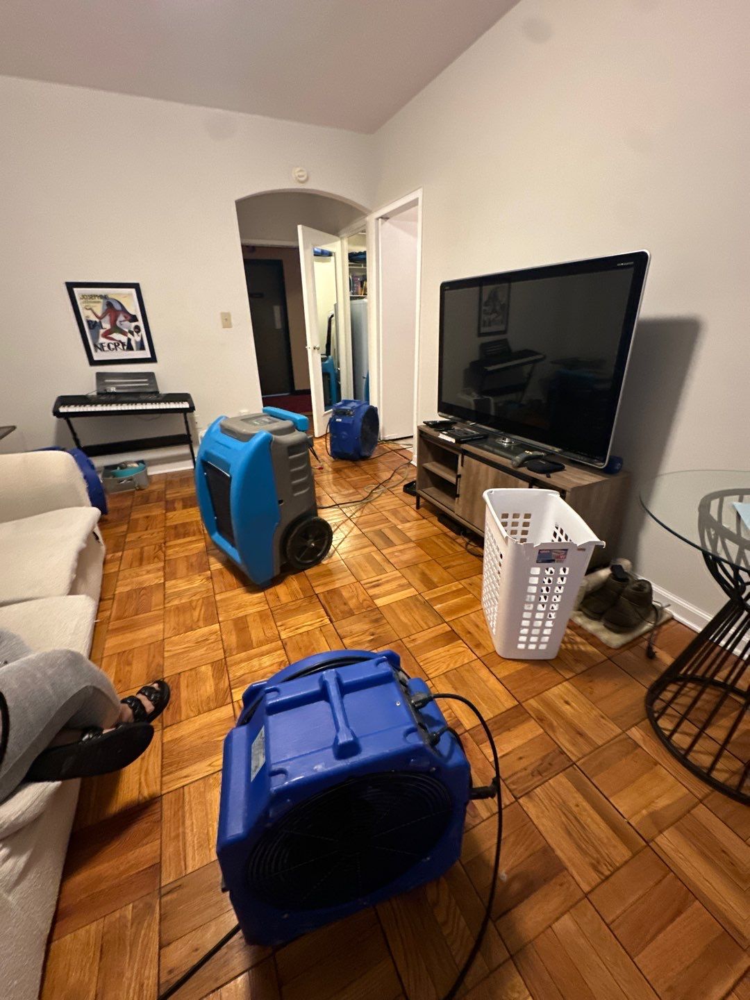 Standing water extraction and dehumidification equipment deployed during water damage restoration in Washington.