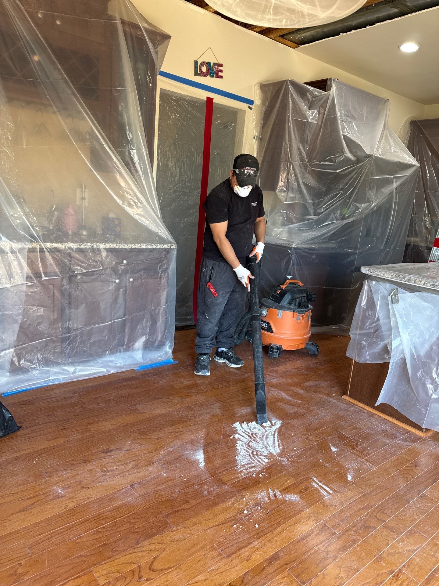 Ceiling damage assessment and preparation for structural repair work.