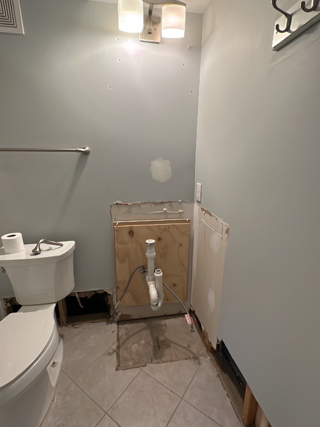 Standing water extraction underway during water damage restoration in Washington.