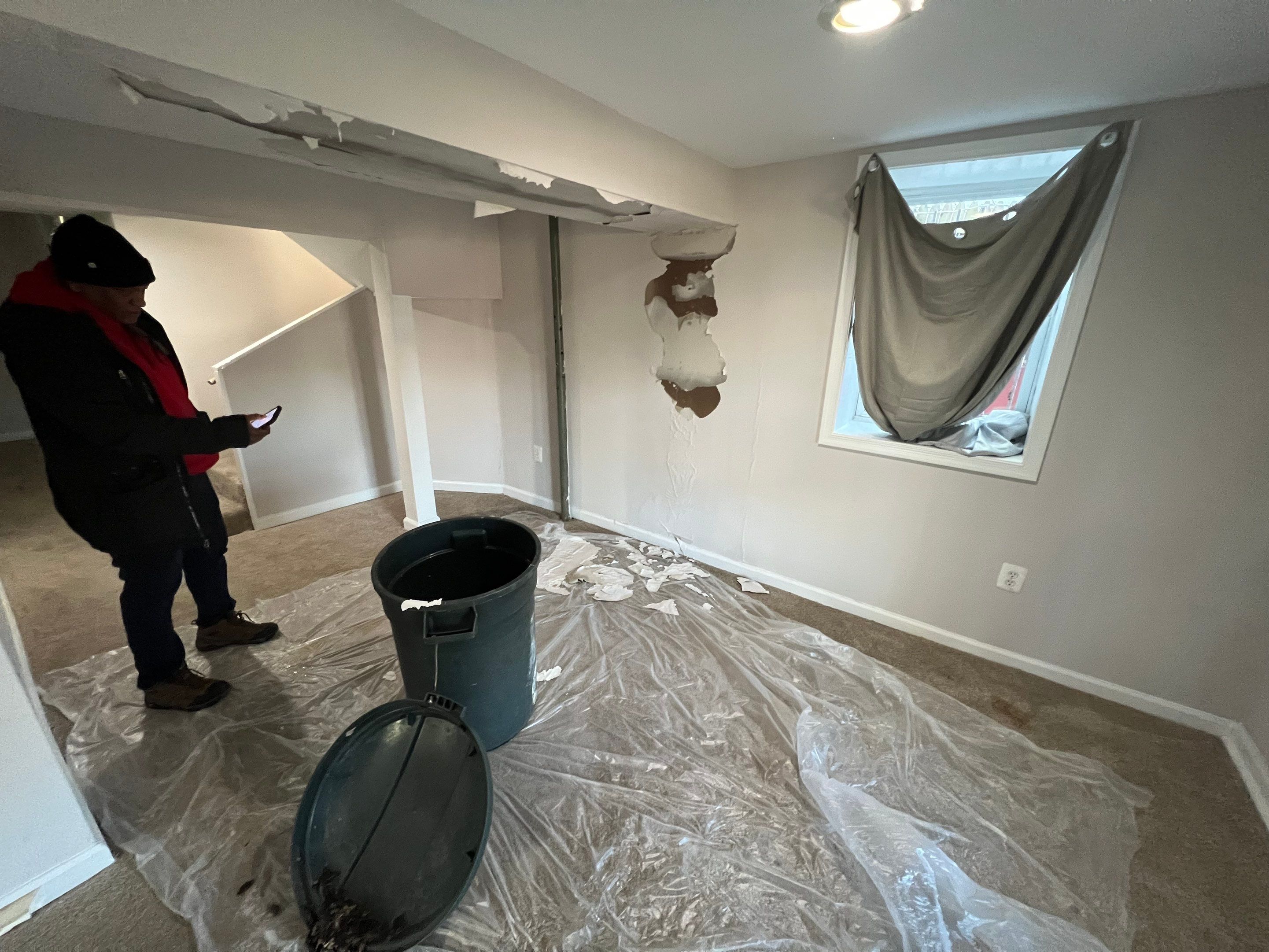 Dehumidifier and air circulation setup continuing mold remediation work in Washington.