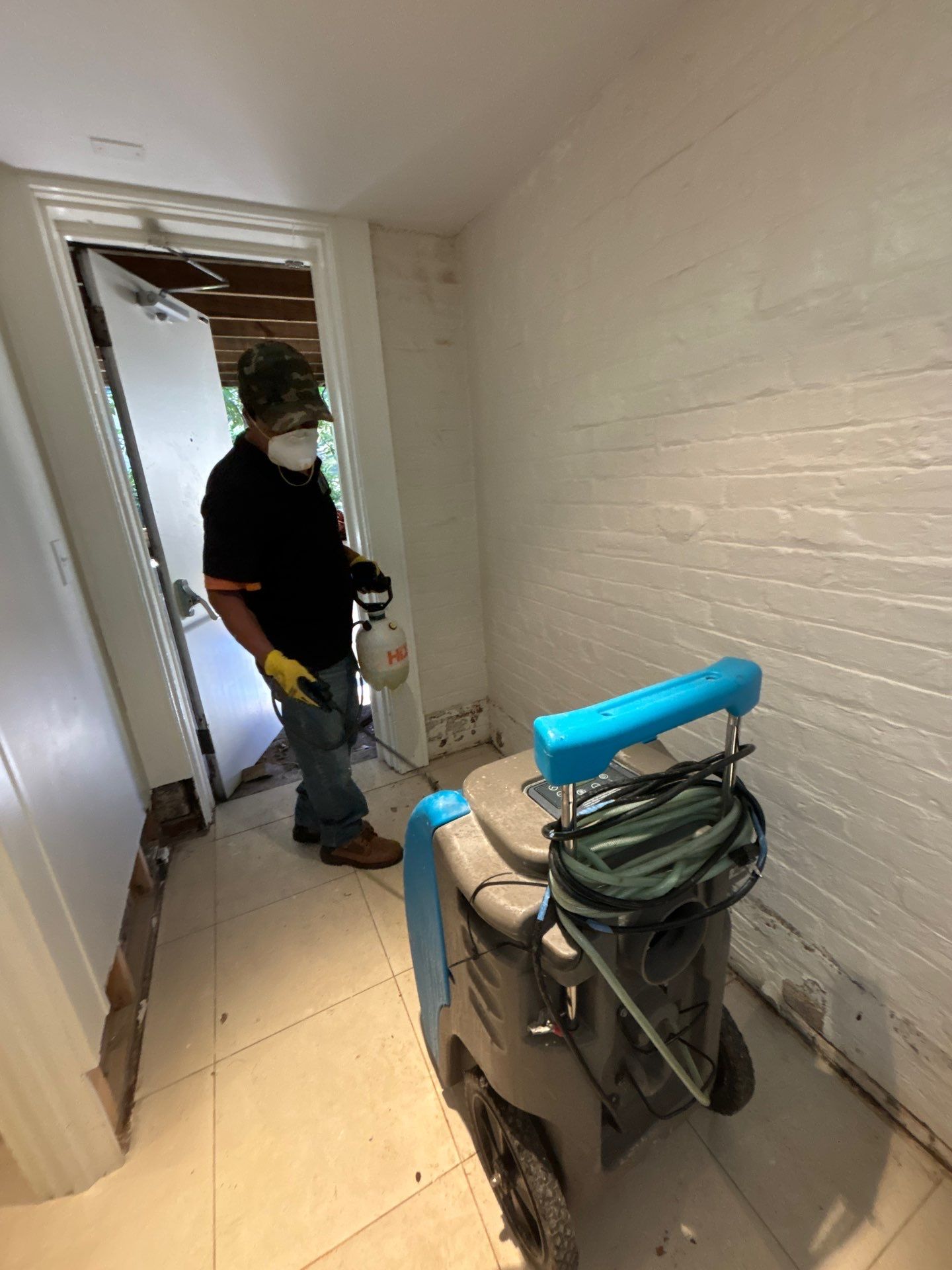 Dehumidification equipment positioned throughout affected area to manage moisture during structural drying phase of restoration.