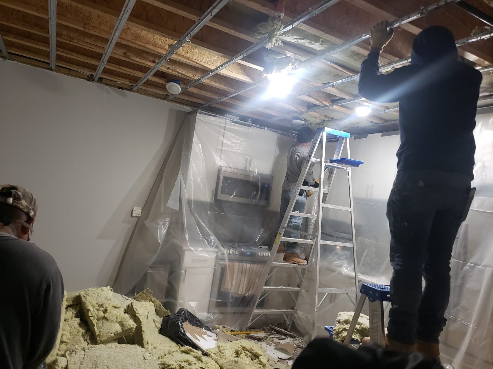 Final-stage water damage restoration in Washington, with equipment removal and structural drying nearing completion.