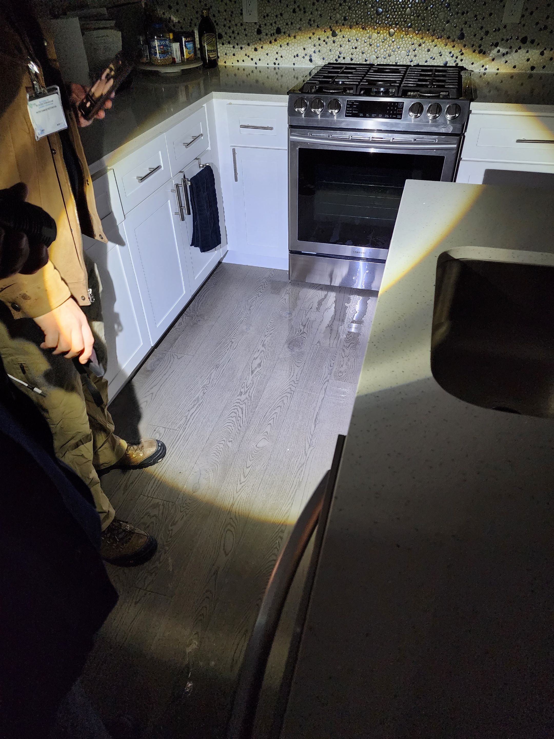 Standing water extraction underway during water damage restoration in Washington, removing pooled water from affected interior space.
