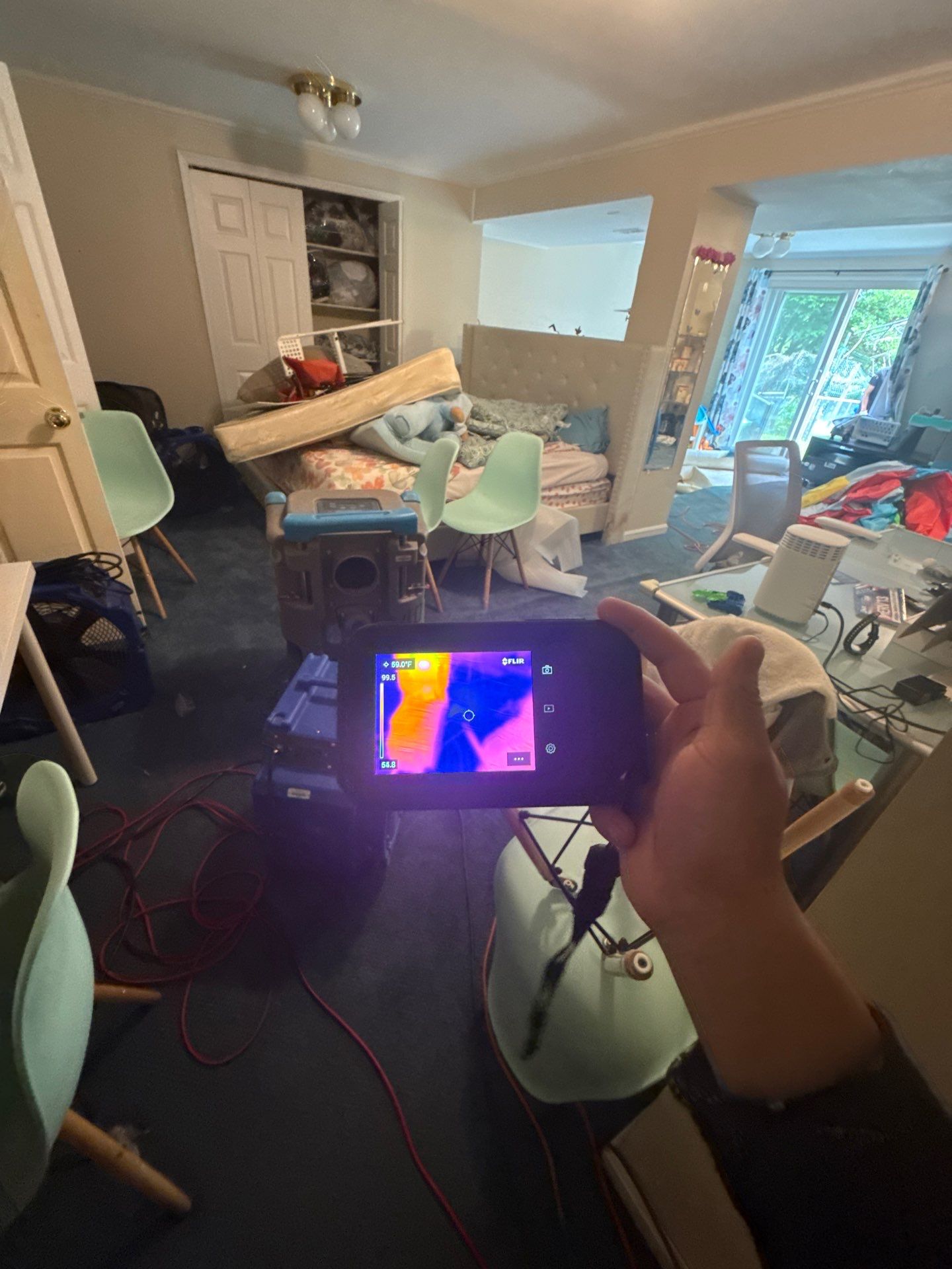 Thermal imaging camera documenting moisture distribution in Potomac water damage restoration.