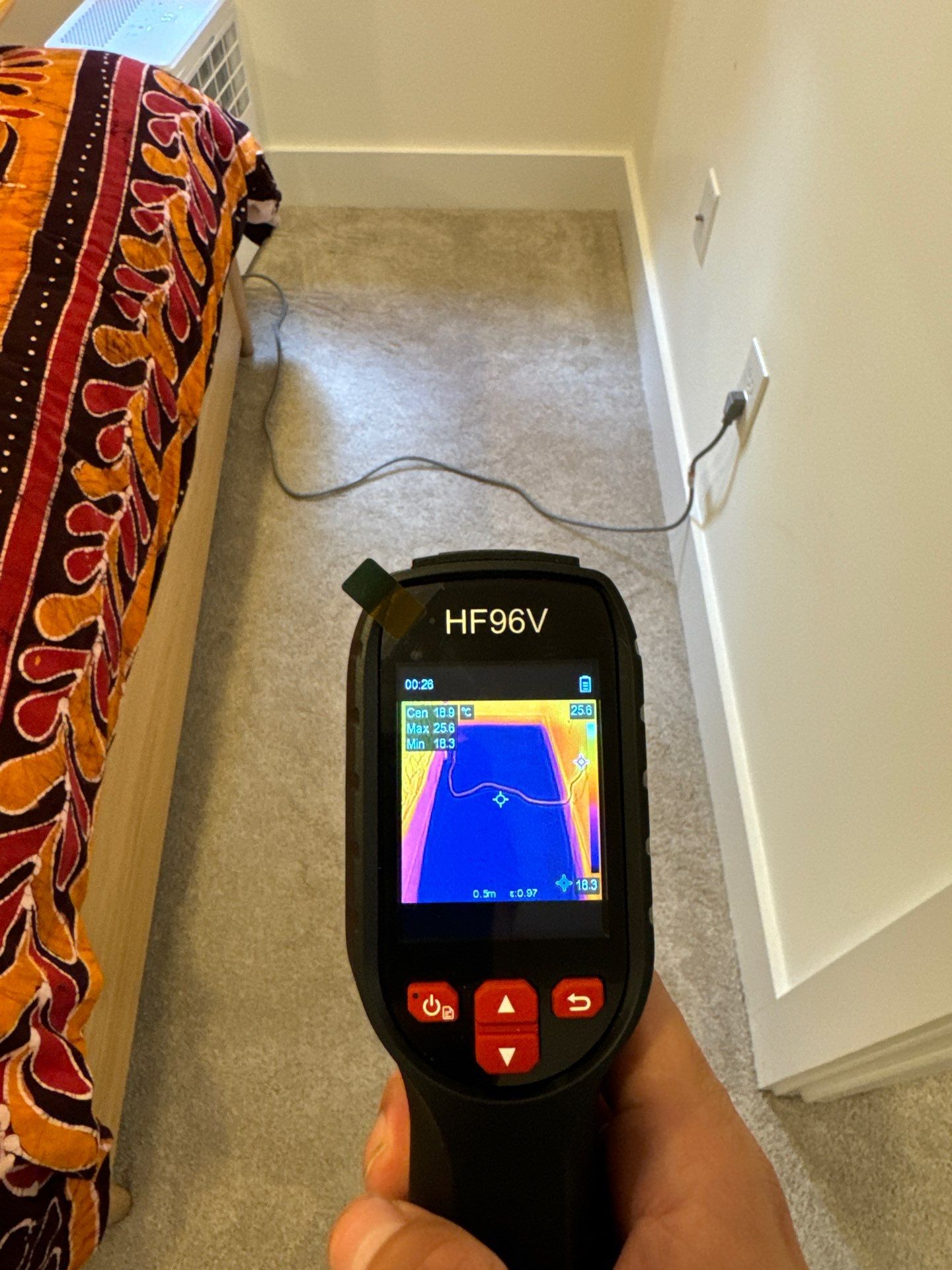Moisture mapping in progress to identify hidden water damage within building materials.