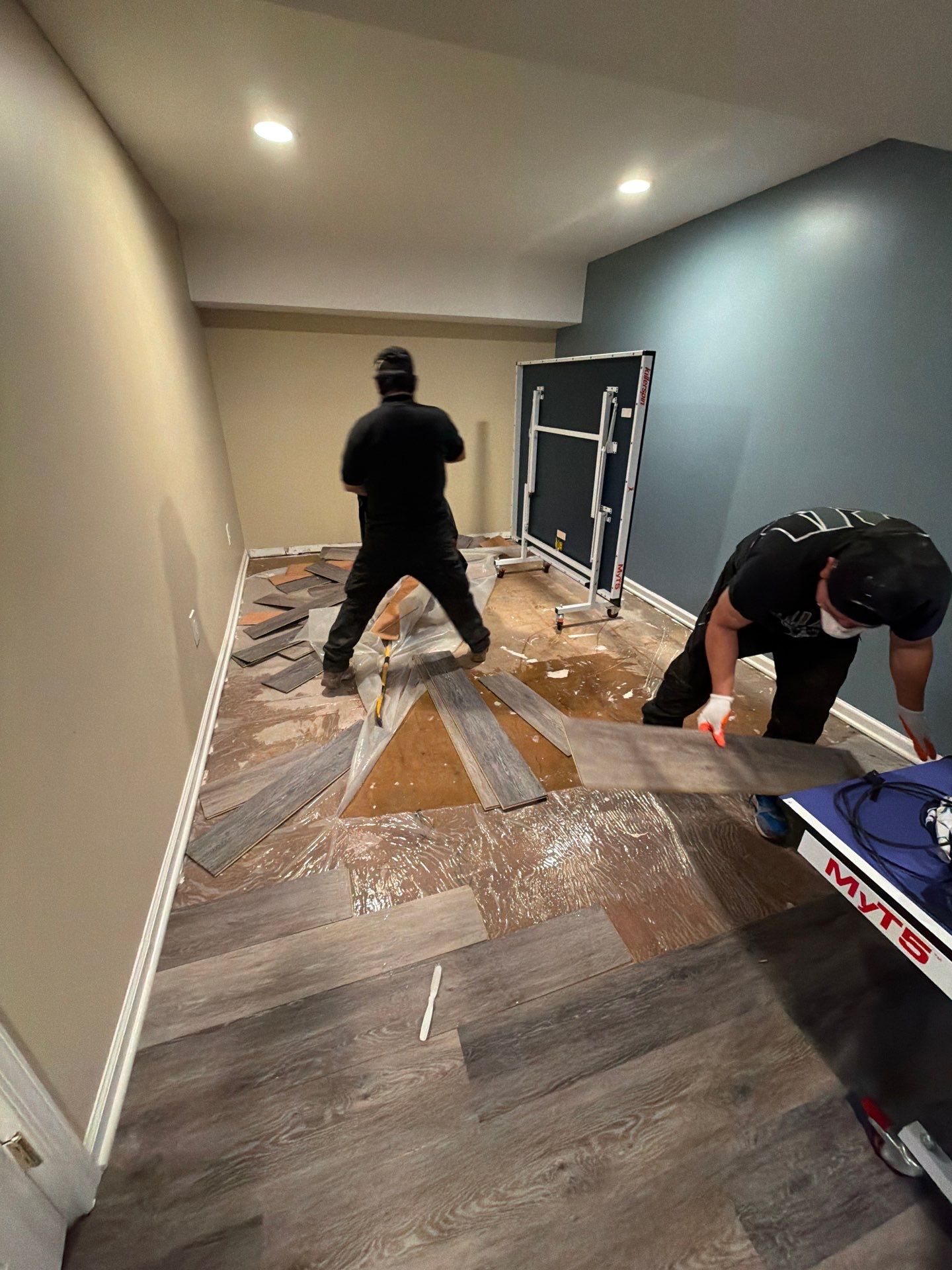 Initial mold remediation assessment in Bethesda showing affected flooring and structural areas requiring drying and removal.