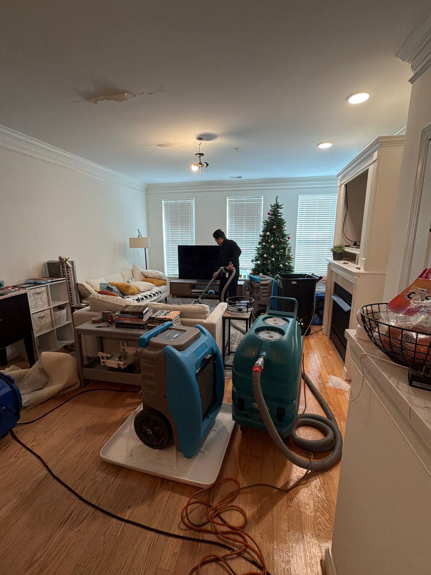 Structural surfaces being prepared and sanitized as part of mold remediation protocol.