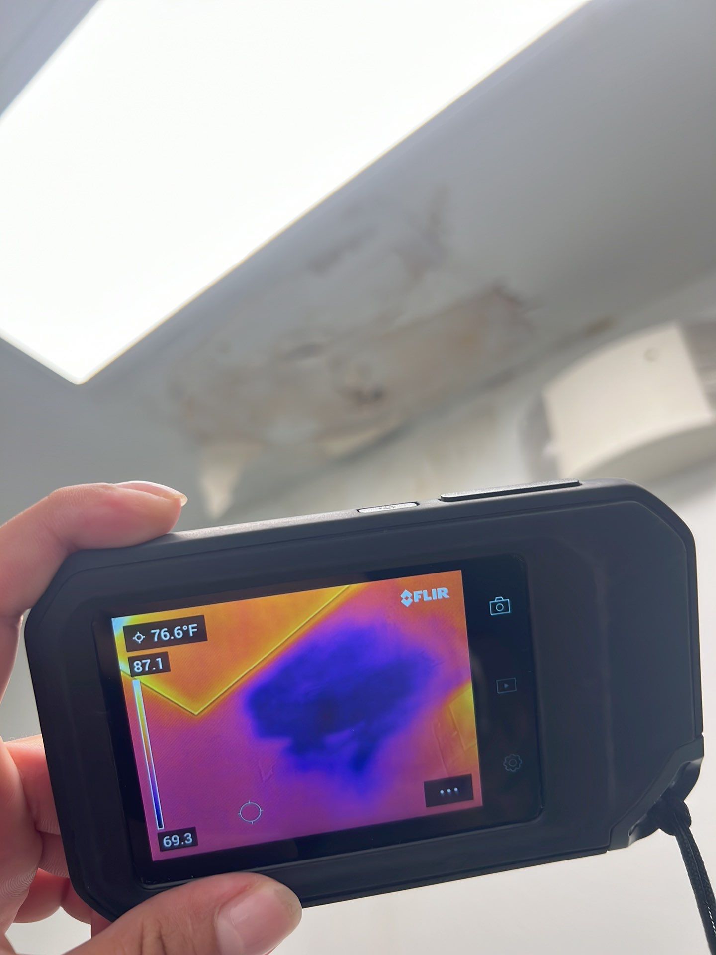 Ceiling damage assessment and preparation for repair following water extraction and drying phase.
