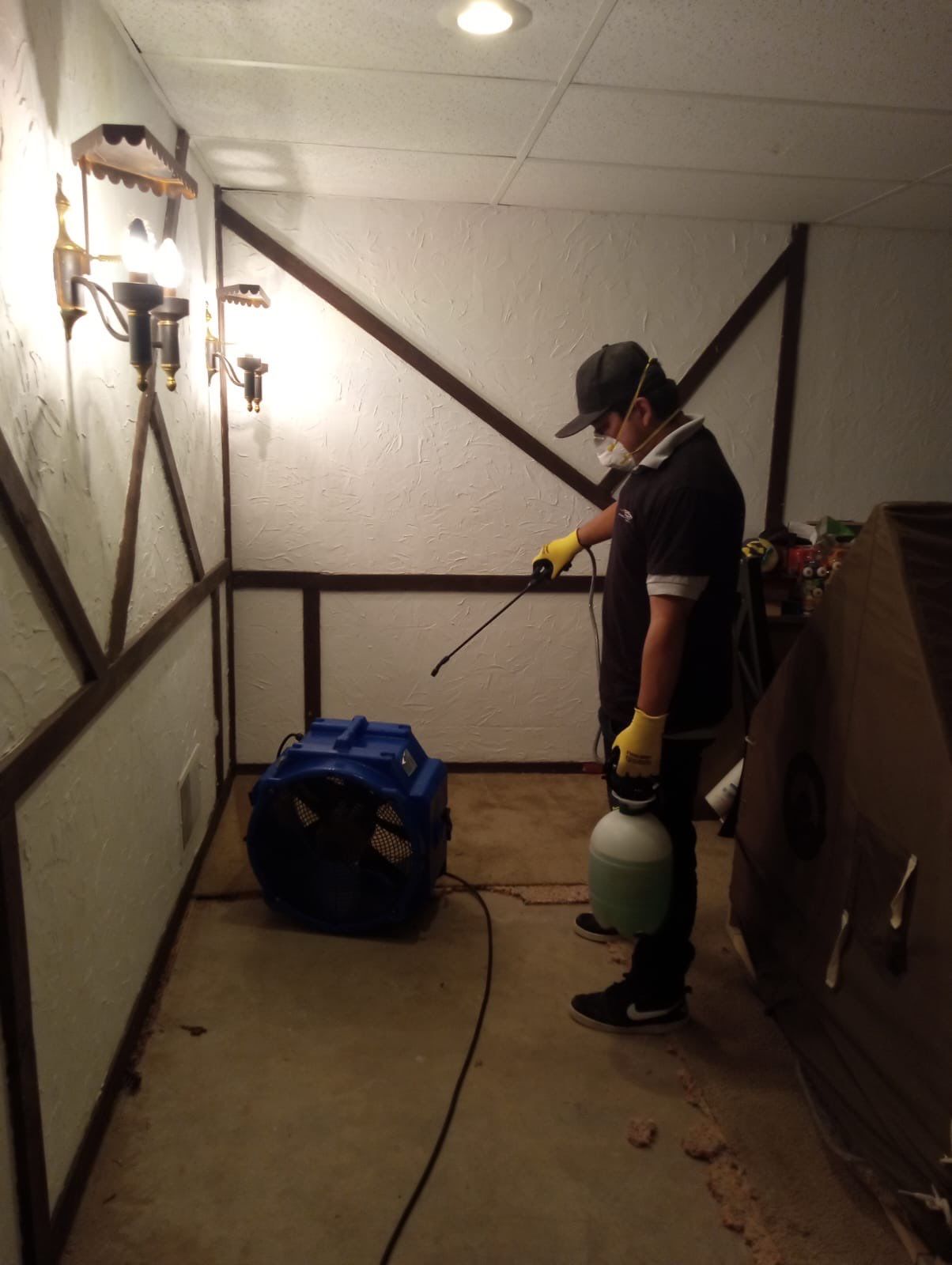 Continued dehumidification and air movement setup during active drying phase of water damage restoration work.