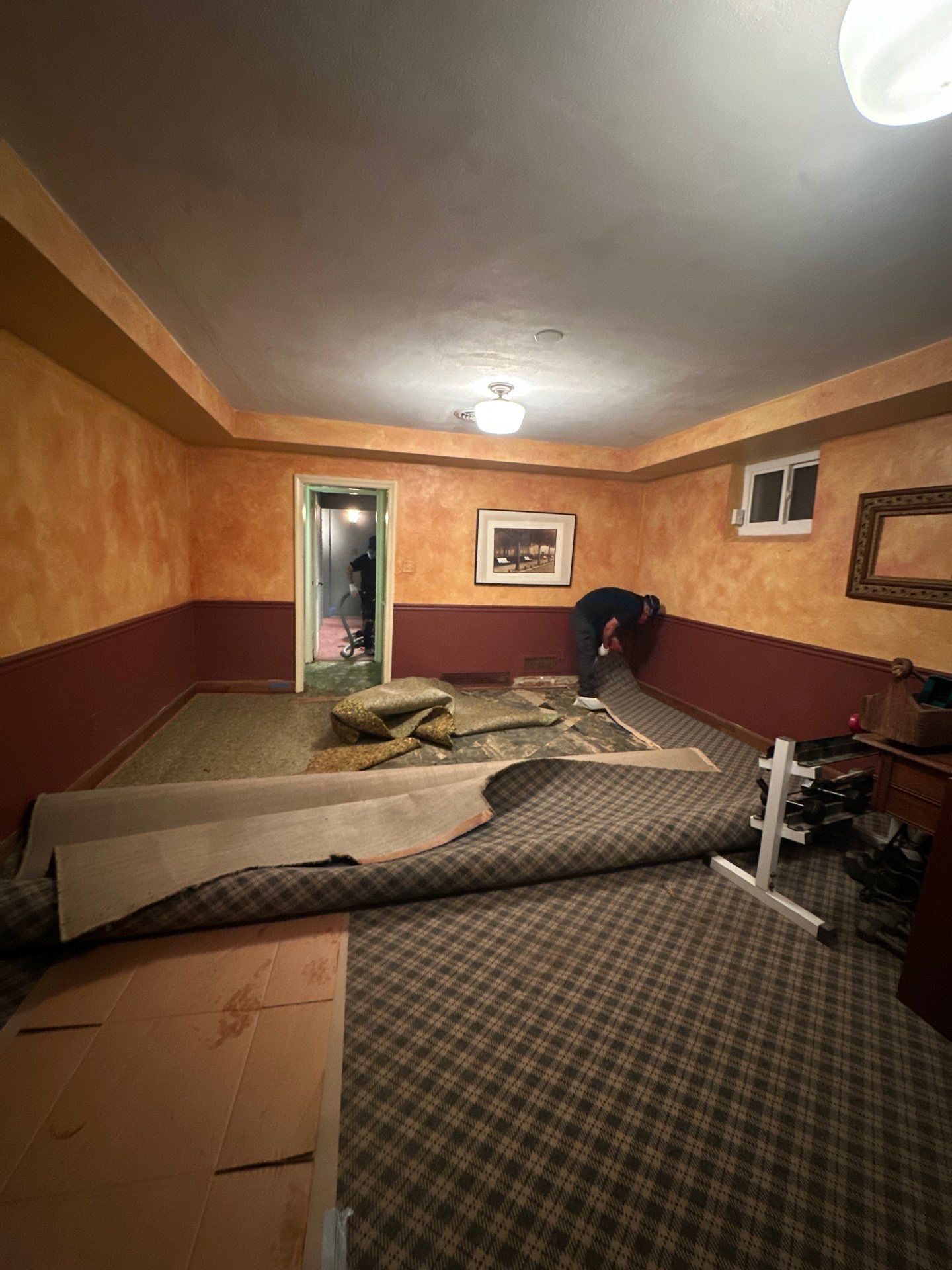 Mid-stage drying showing reduced moisture levels and continued dehumidification of building materials.