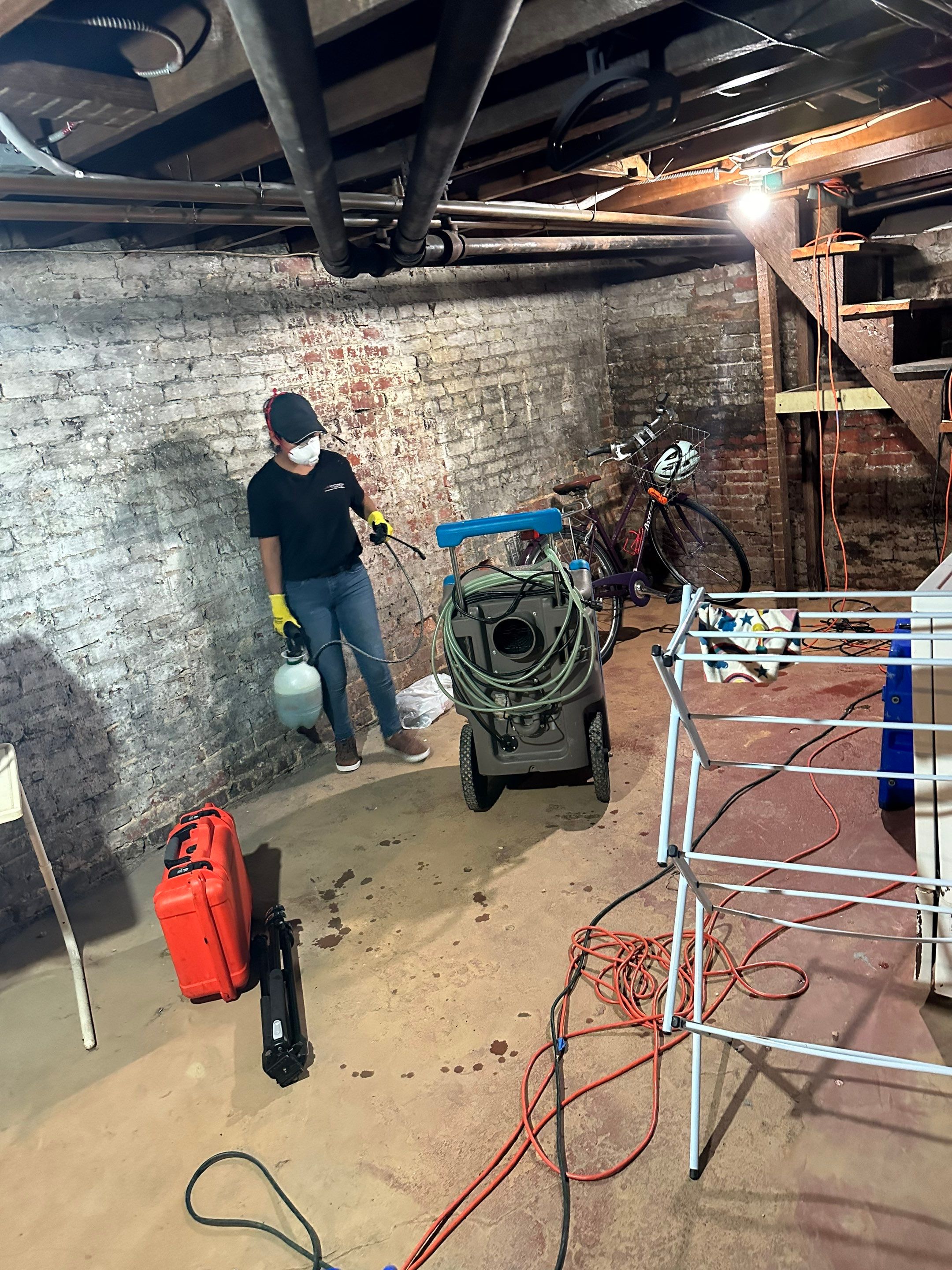Dehumidifier and air movers positioned for structural drying phase of restoration.