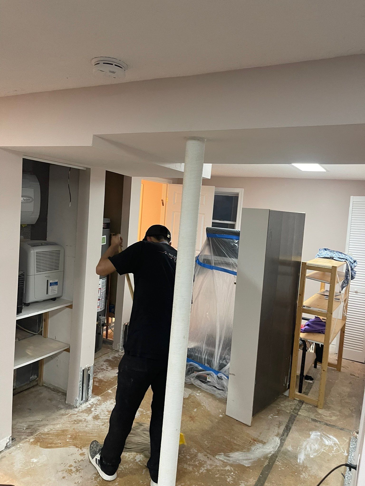 Drying equipment positioned to complete moisture remediation of affected flooring areas.